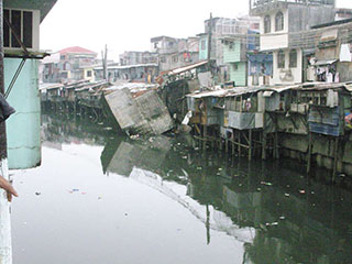 Manila slums on river